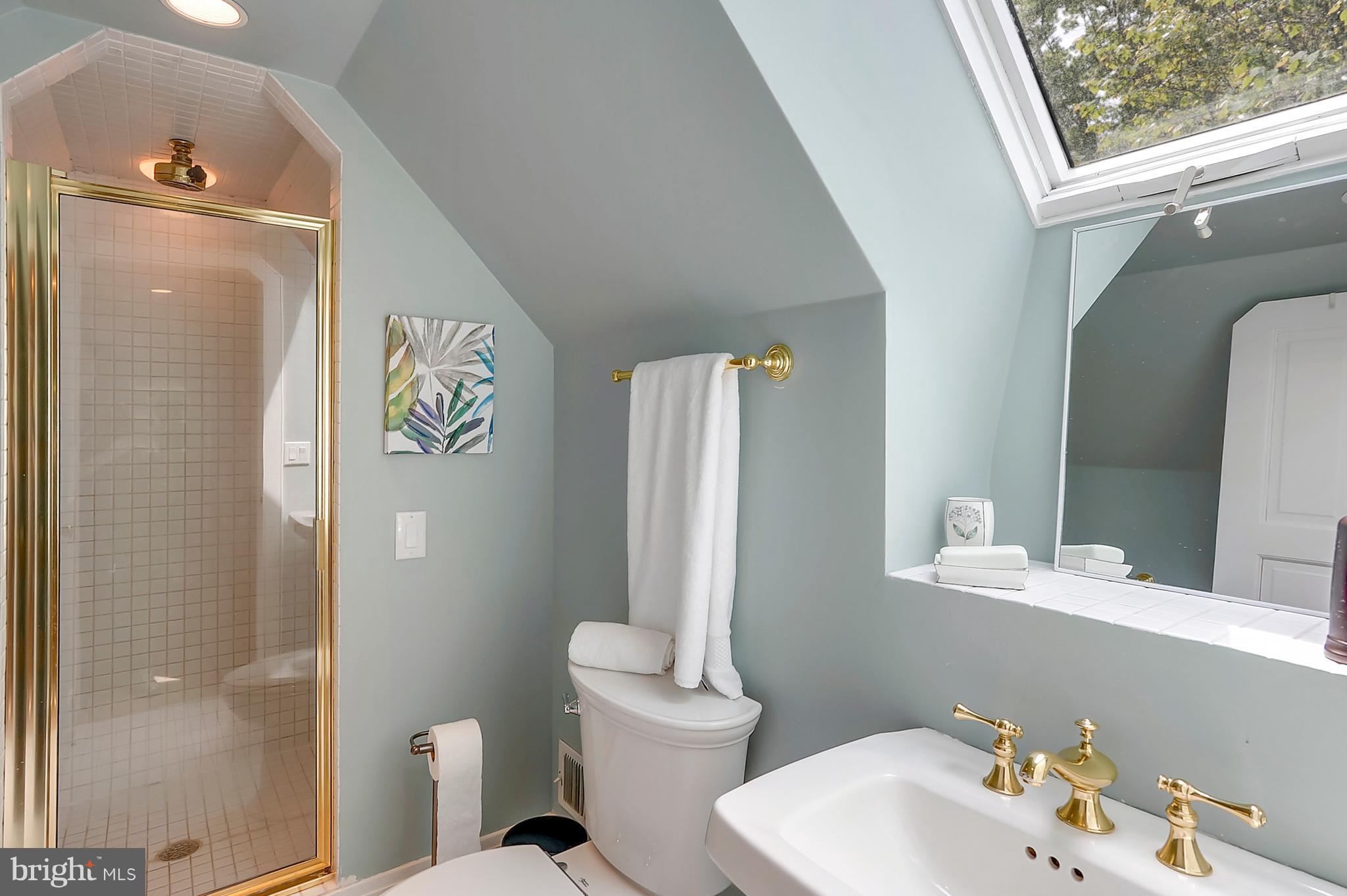 700 Seagull Beach Road Prince Frederick, MD 20678 - Photo 25 of 30 a bathroom with a sink and mirror with toilet