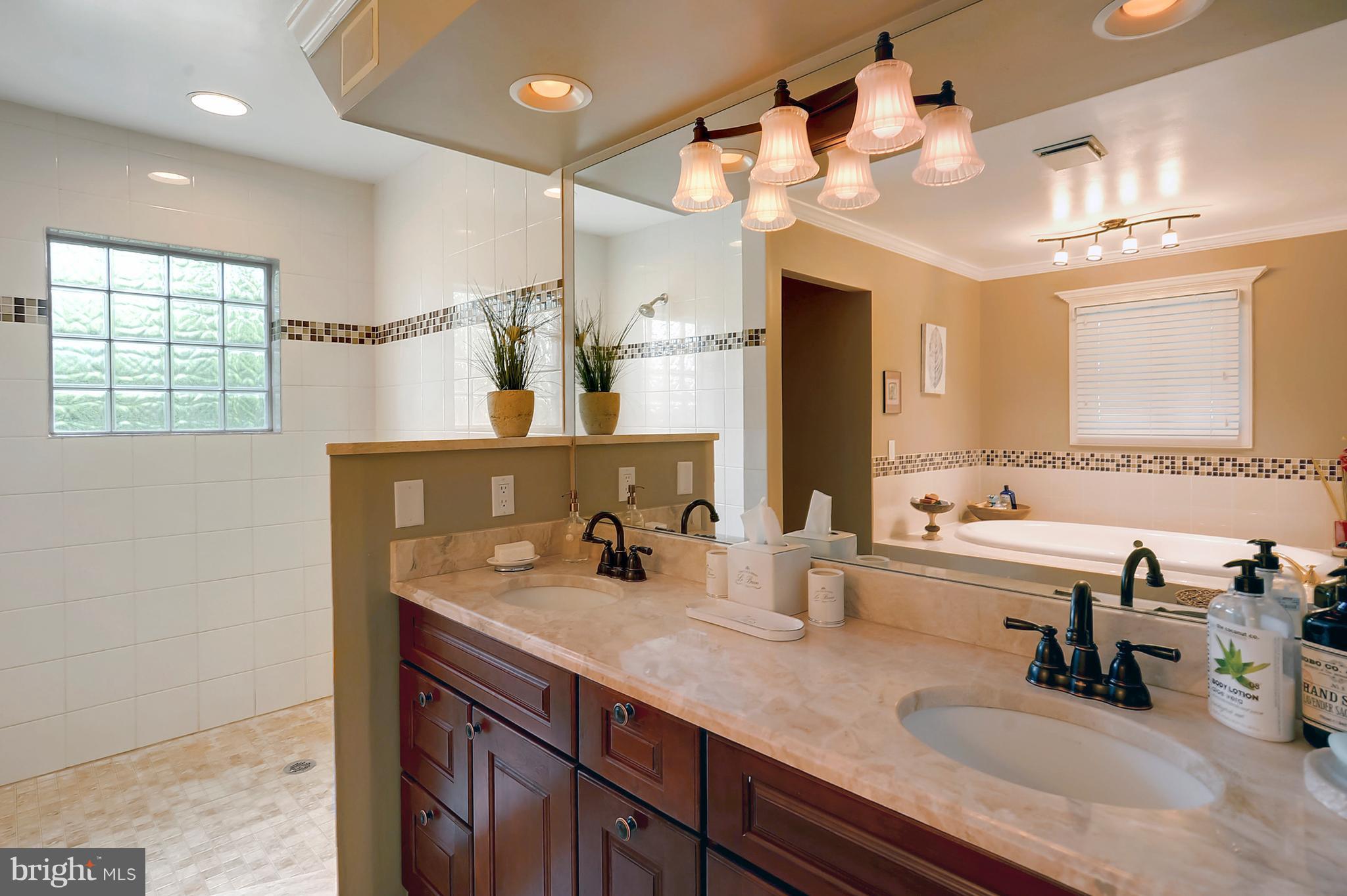 700 Seagull Beach Road Prince Frederick, MD 20678 - Photo 30 of 30 a bathroom with a sink double vanity and a mirror