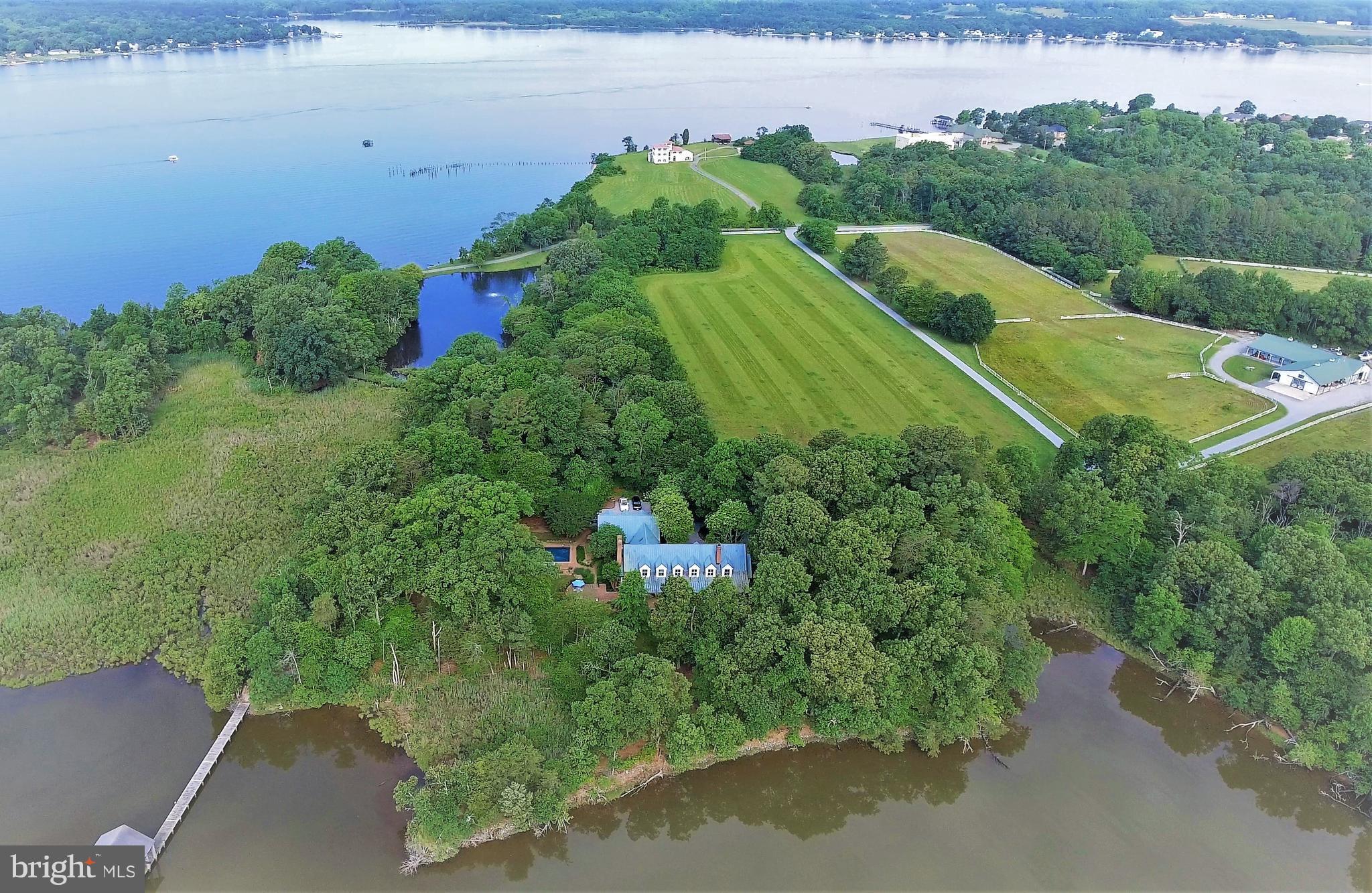 700 Seagull Beach Road Prince Frederick, MD 20678 - Photo 4 of 30 an aerial view of a house with a yard and lake view