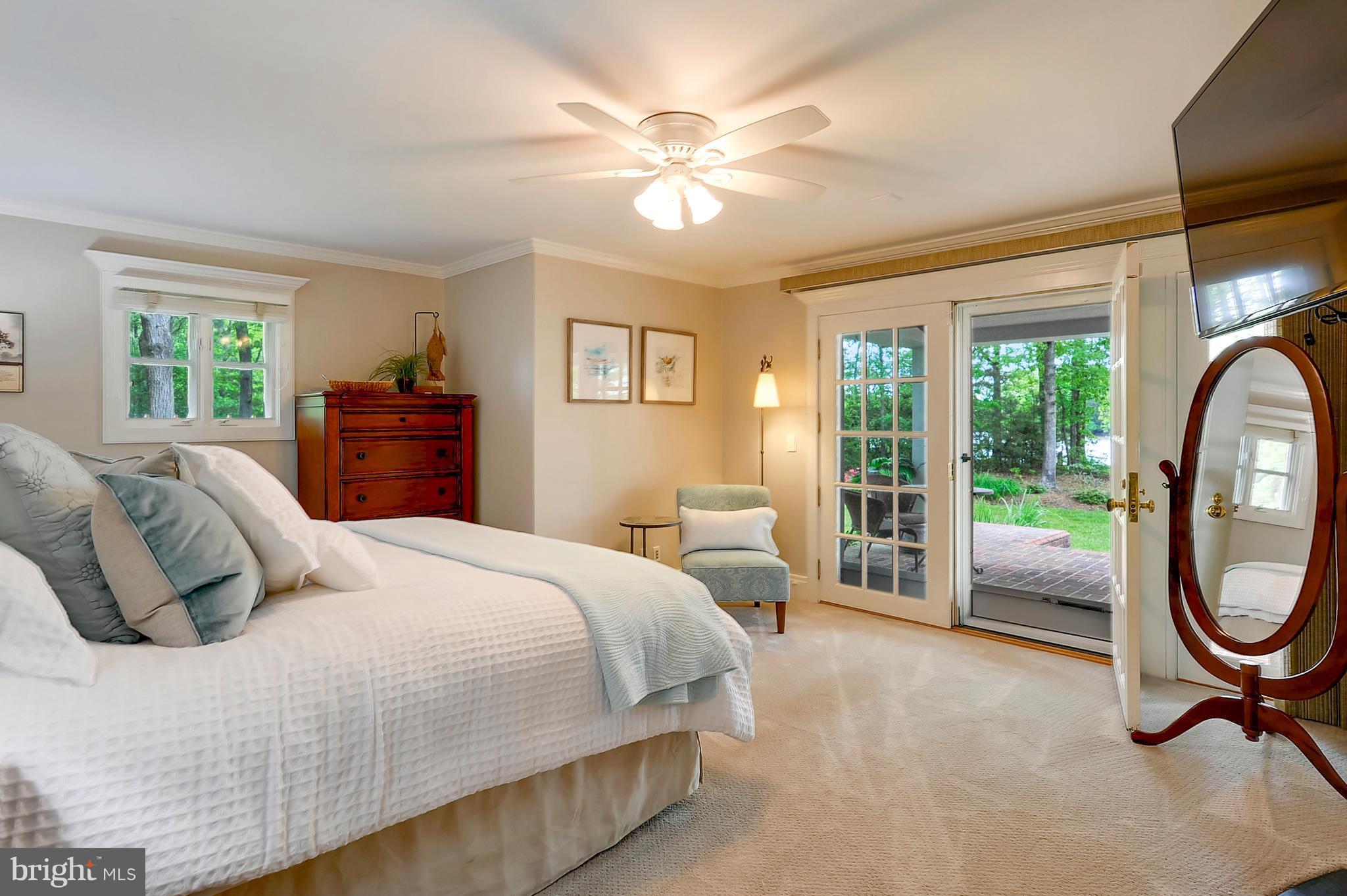 700 Seagull Beach Road Prince Frederick, MD 20678 - Photo 5 of 30 a bedroom with a bed and a large window with the outer view