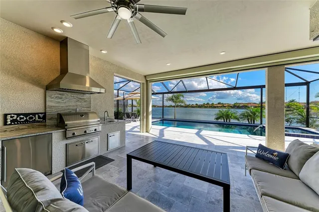 a living room with furniture a floor to ceiling window and a flat screen tv