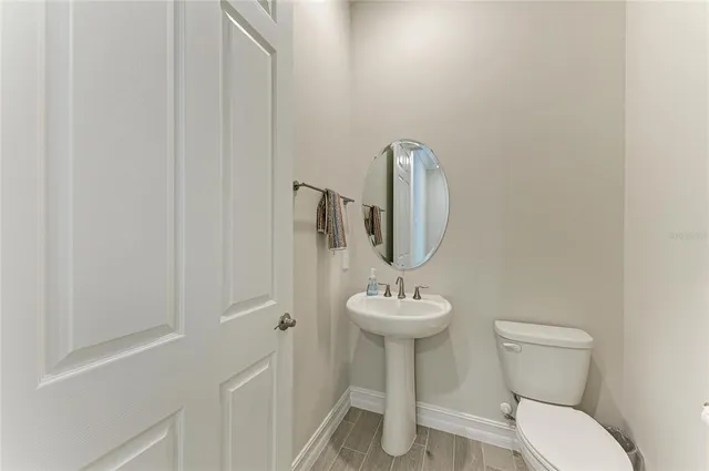 an aerial view of a house with a lake view