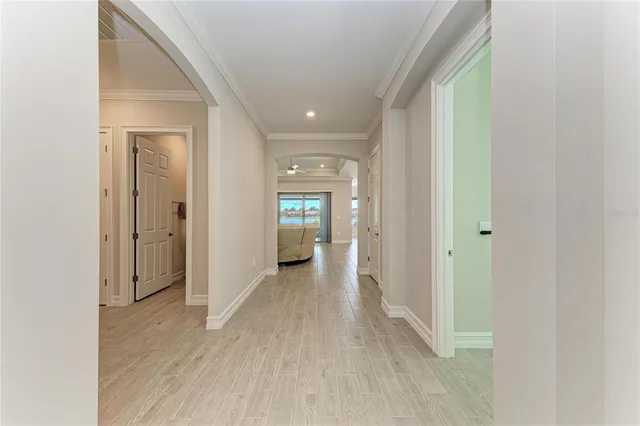a view of a living room and floor to ceiling window or kitchen