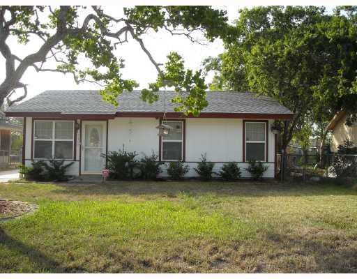 a view of a house with a garden and yard