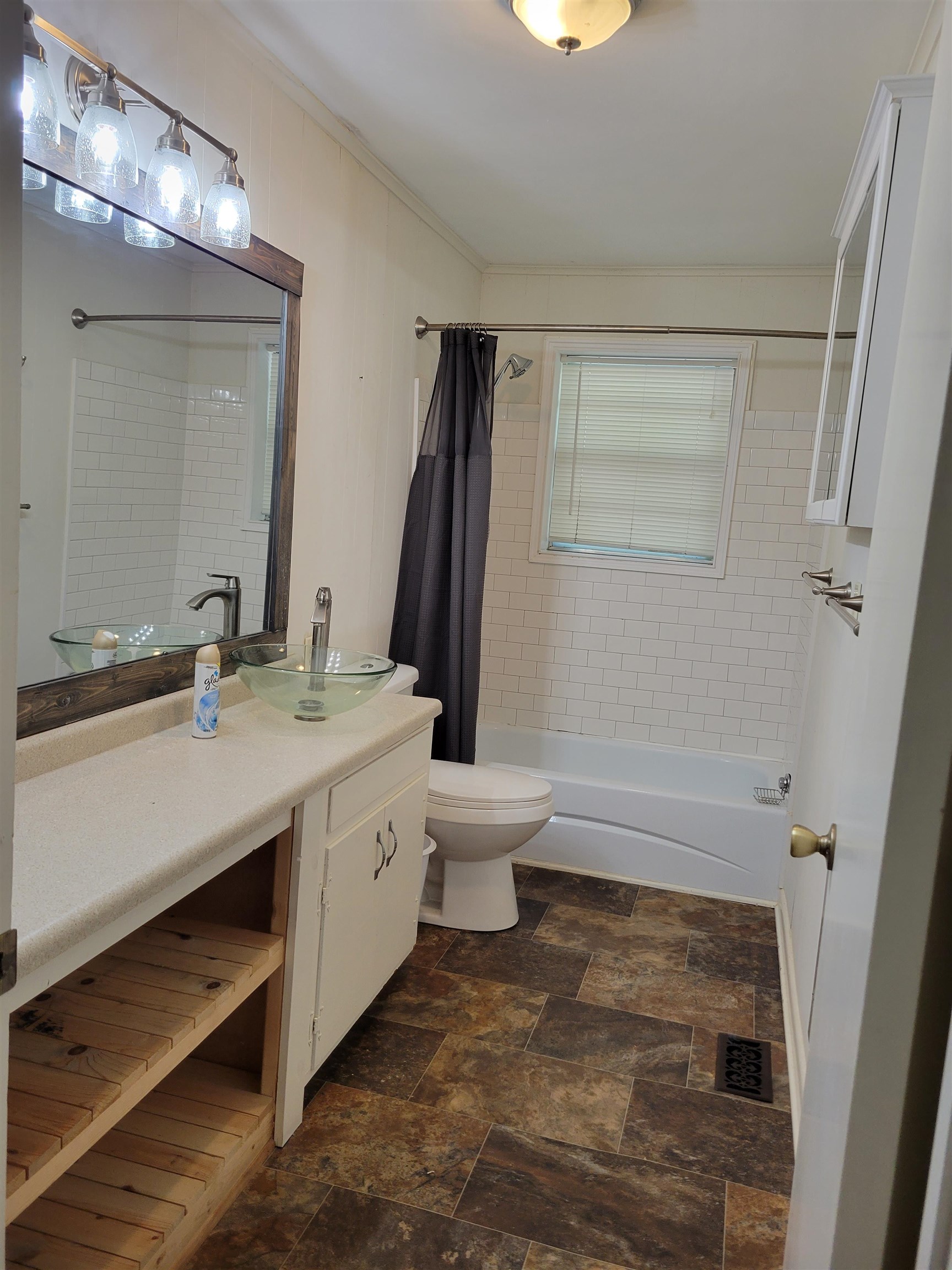 1572 Asbury Glimp Road Ripley, TN 38063 - Photo 15 of 20 a bathroom with a sink a toilet and shower