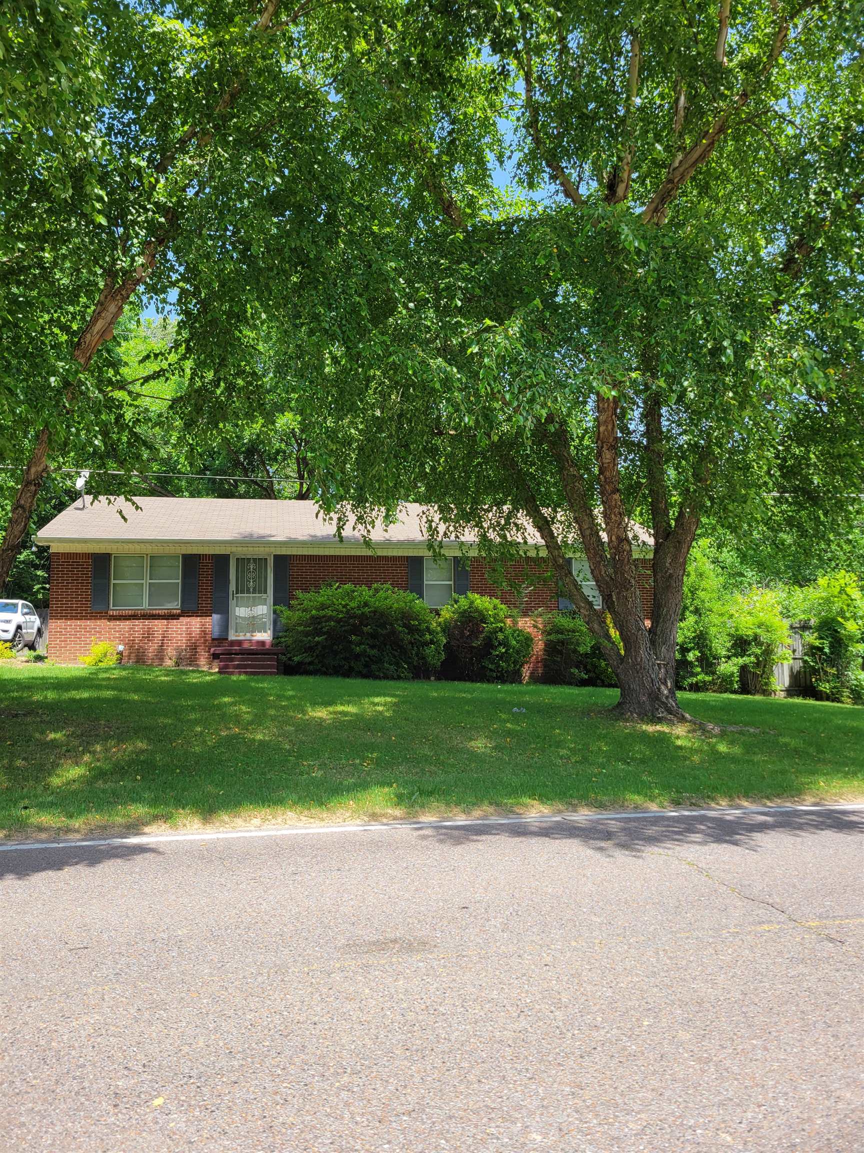 1572 Asbury Glimp Road Ripley, TN 38063 - Photo 2 of 20 a front view of house with yard and green space