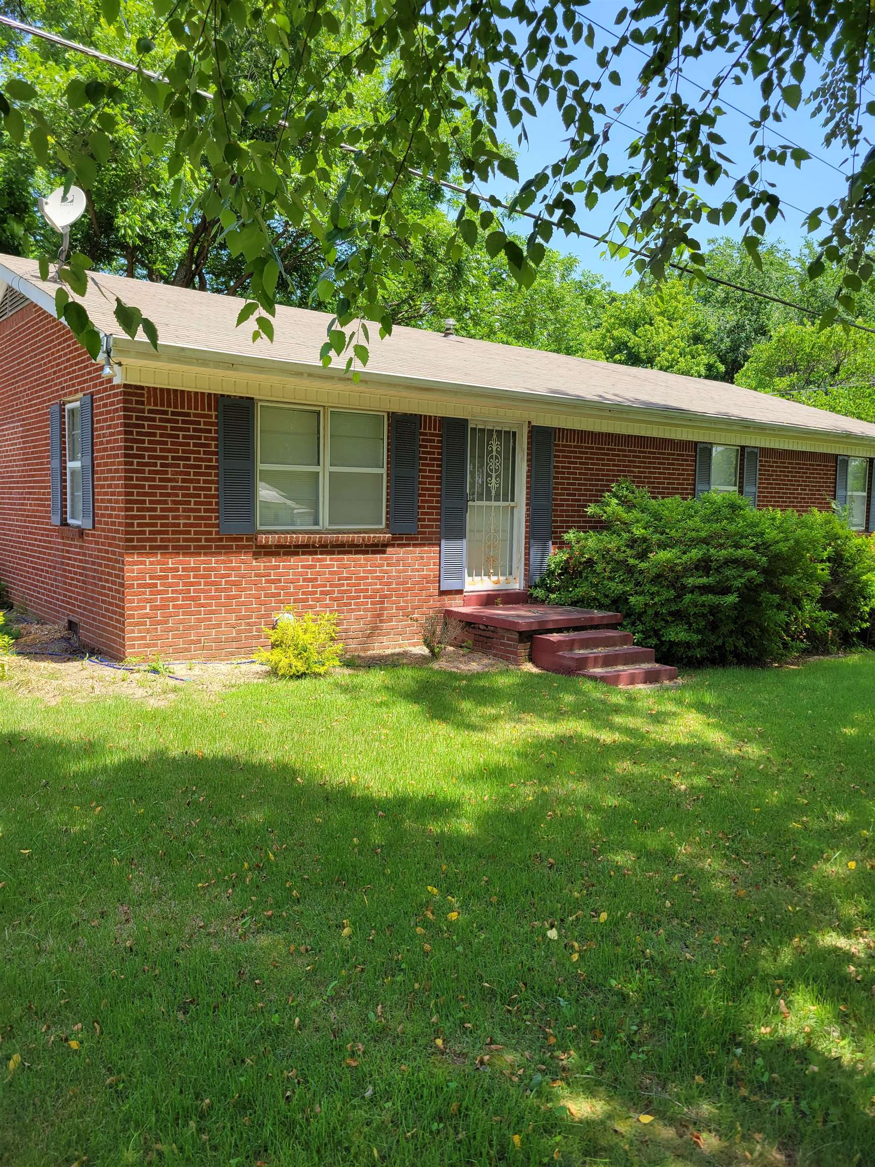 1572 Asbury Glimp Road Ripley, TN 38063 - Photo 4 of 20 a front view of house with yard and green space