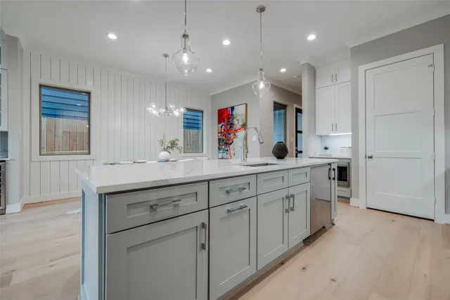 a kitchen with stove and cabinets