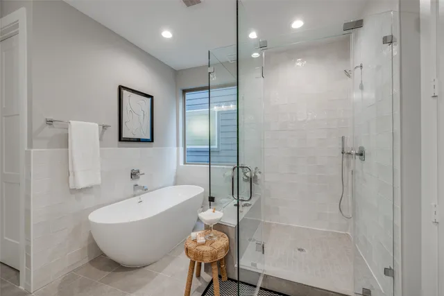 a living room with furniture a window and a flat screen tv
