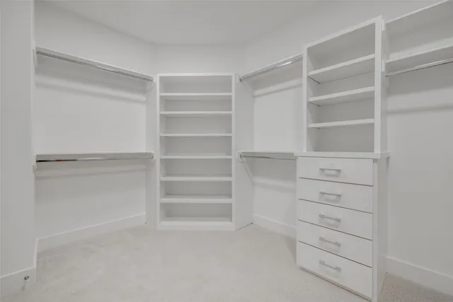a bathroom with a granite countertop sink a toilet and a bathtub