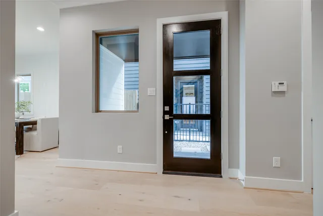 a view of entryway with wooden floor and stairs