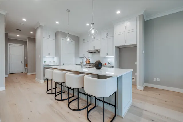a kitchen with a sink and a refrigerator