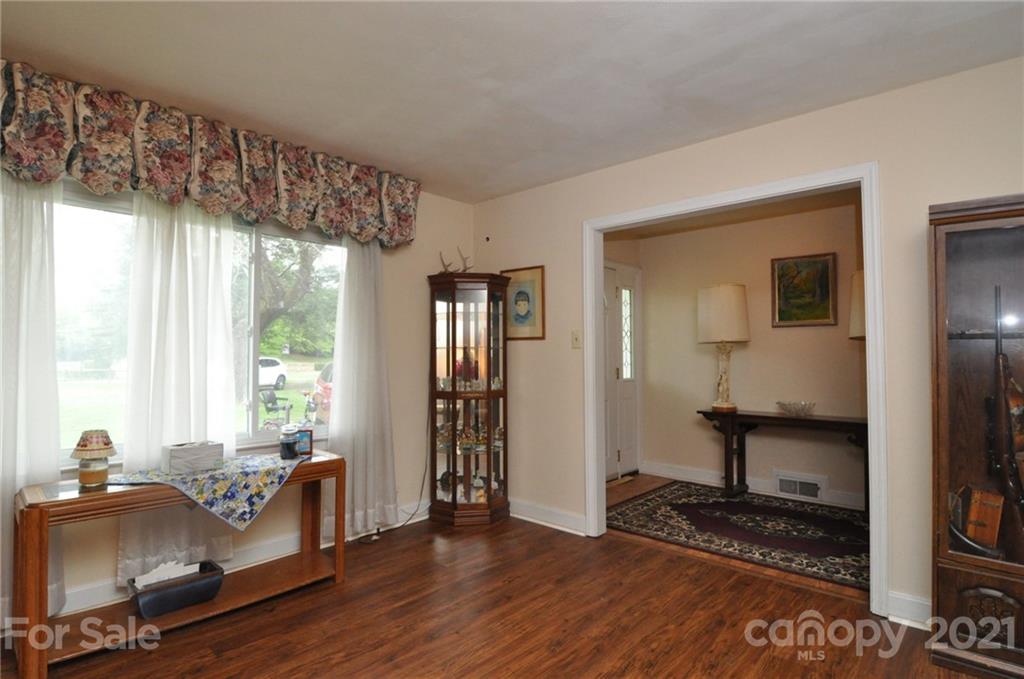 501 Redland Road Landrum, SC 29356 - Photo 11 of 38 a livingroom with furniture window and wooden floor