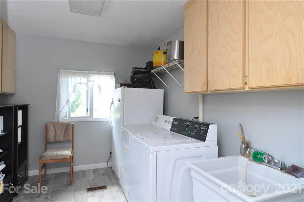 501 Redland Road Landrum, SC 29356 - Photo 16 of 38 a kitchen with a sink cabinets and a window