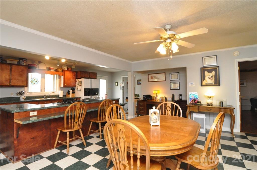 501 Redland Road Landrum, SC 29356 - Photo 19 of 38 a view of a dining room with furniture and chandelier