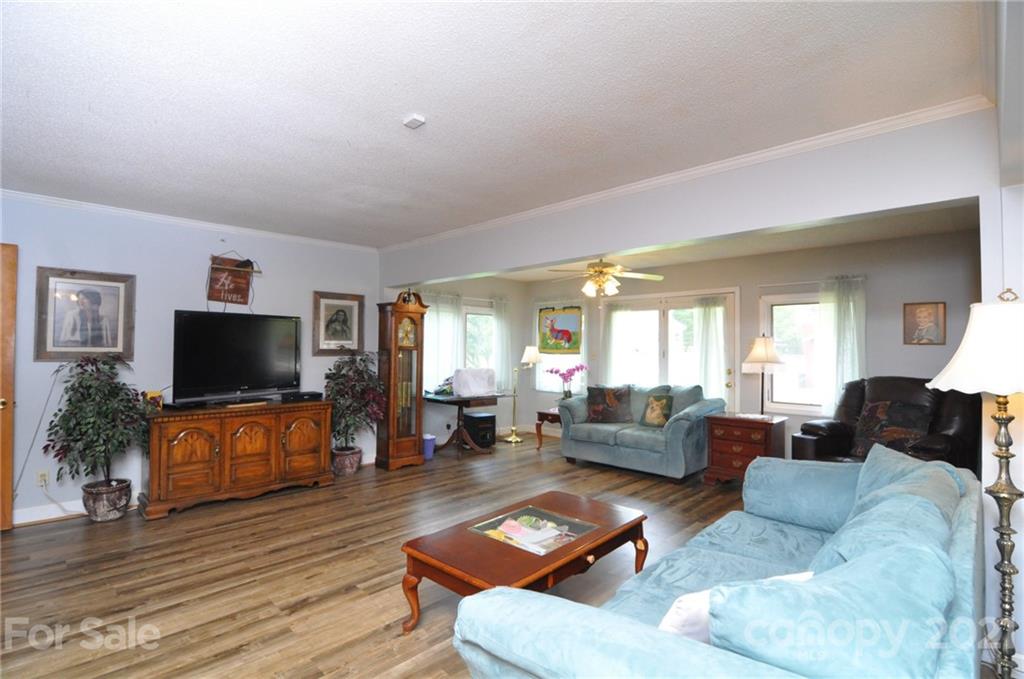 501 Redland Road Landrum, SC 29356 - Photo 20 of 38 a living room with furniture and a flat screen tv