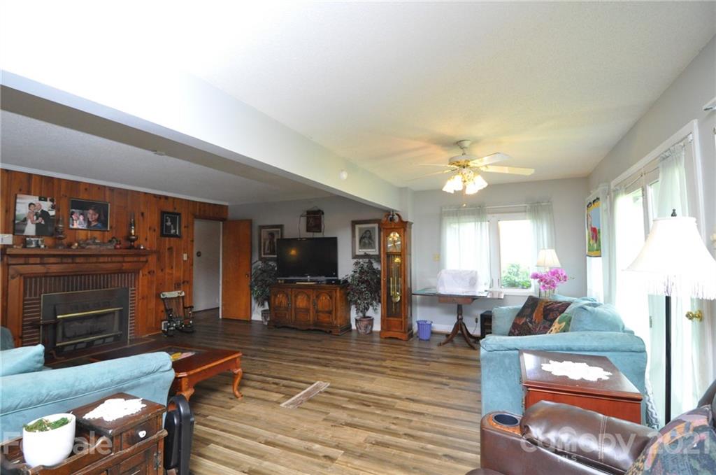 501 Redland Road Landrum, SC 29356 - Photo 21 of 38 a living room with furniture and a flat screen tv