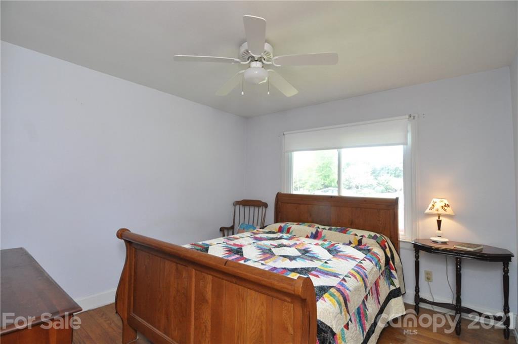 501 Redland Road Landrum, SC 29356 - Photo 26 of 38 a bedroom with a bed and a window
