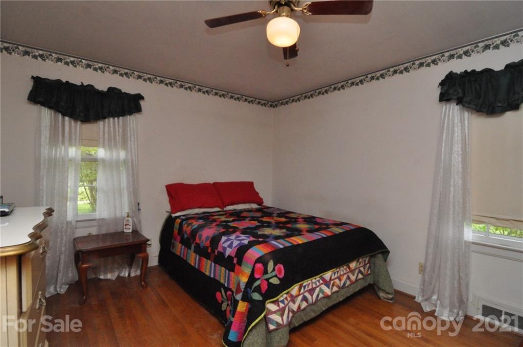 501 Redland Road Landrum, SC 29356 - Photo 27 of 38 a bedroom with a bed and window