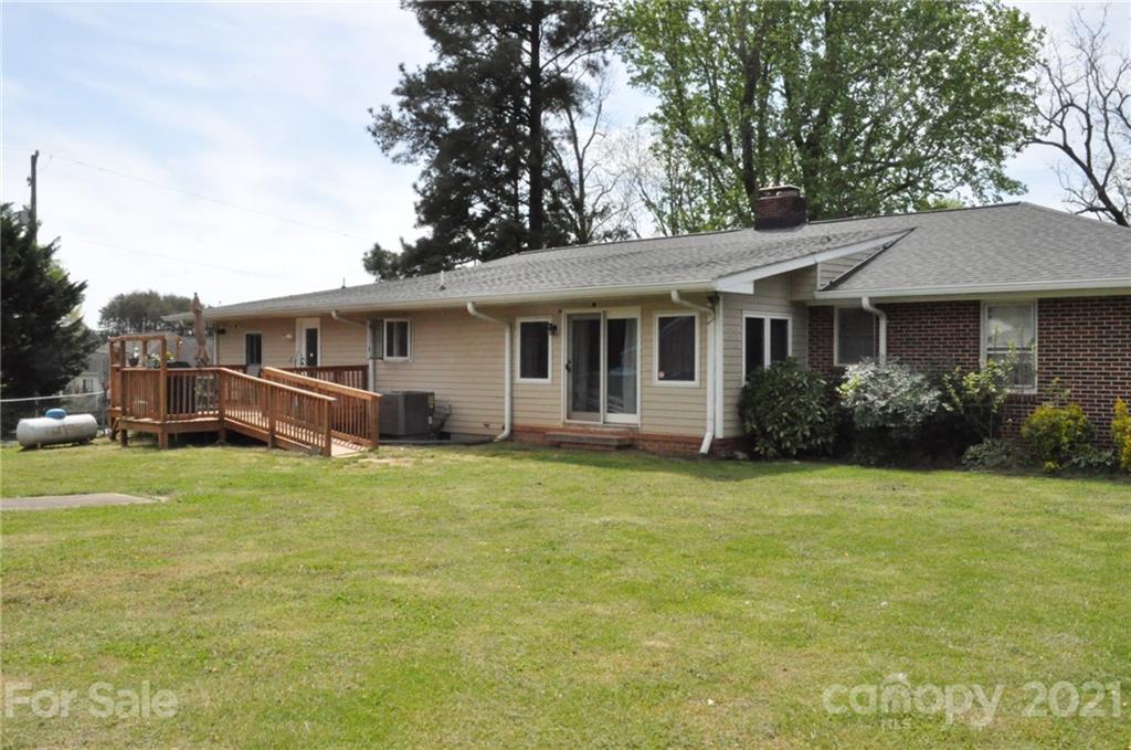 501 Redland Road Landrum, SC 29356 - Photo 5 of 38 a front view of house with yard and trees
