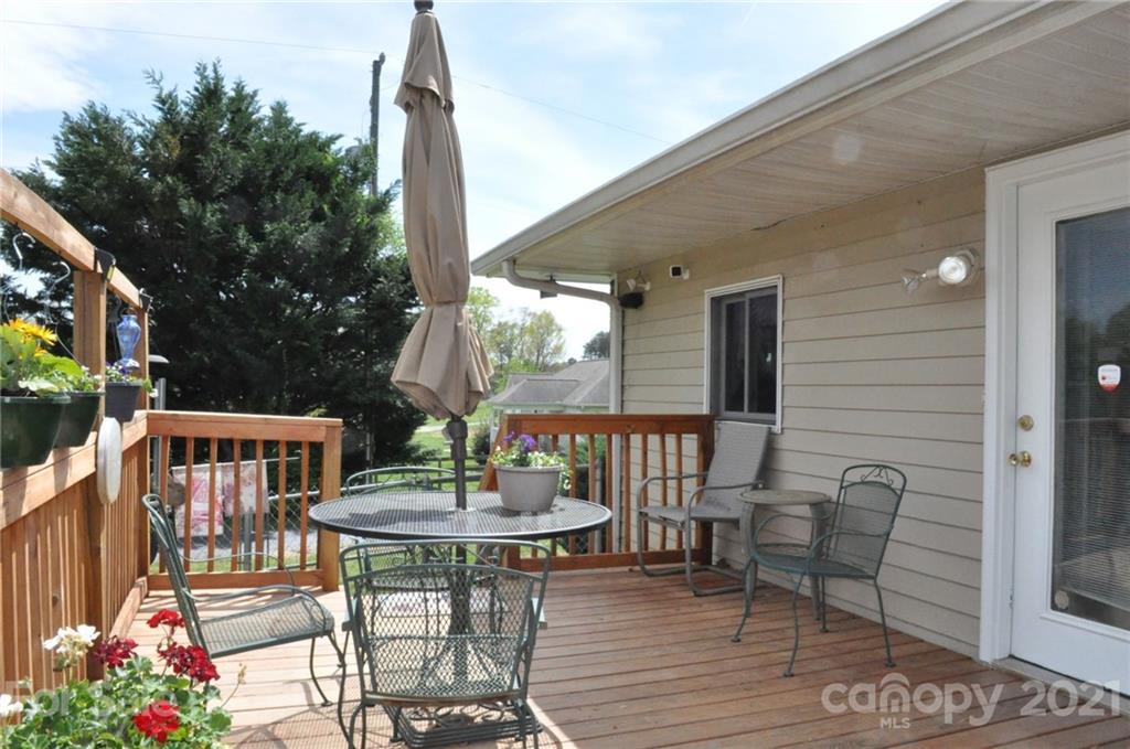 501 Redland Road Landrum, SC 29356 - Photo 6 of 38 a view of a patio with a table and chairs