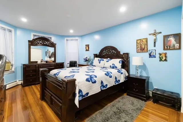 a bed room with a bed and a night stand