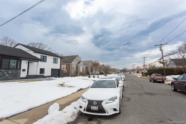 a view of a street with cars