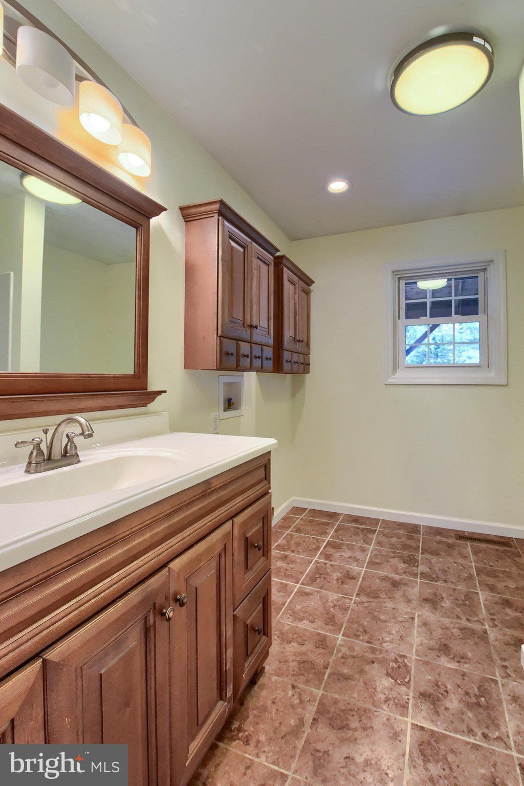 3740 Beagle Road Middletown, PA 17057 - Photo 18 of 70 a view of a bathroom with a sink and a mirror