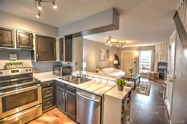 a kitchen with a sink stove and cabinets