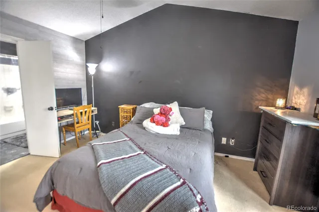 a bedroom with a bed and furniture