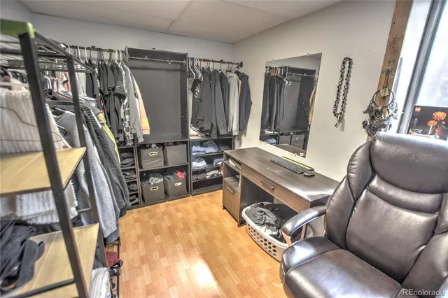a living room with lots of furniture and a rug