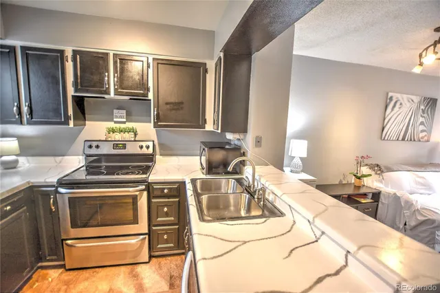 a kitchen with a stove and a sink