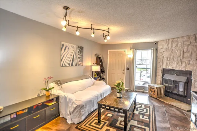 a bedroom with a bed dresser and a window