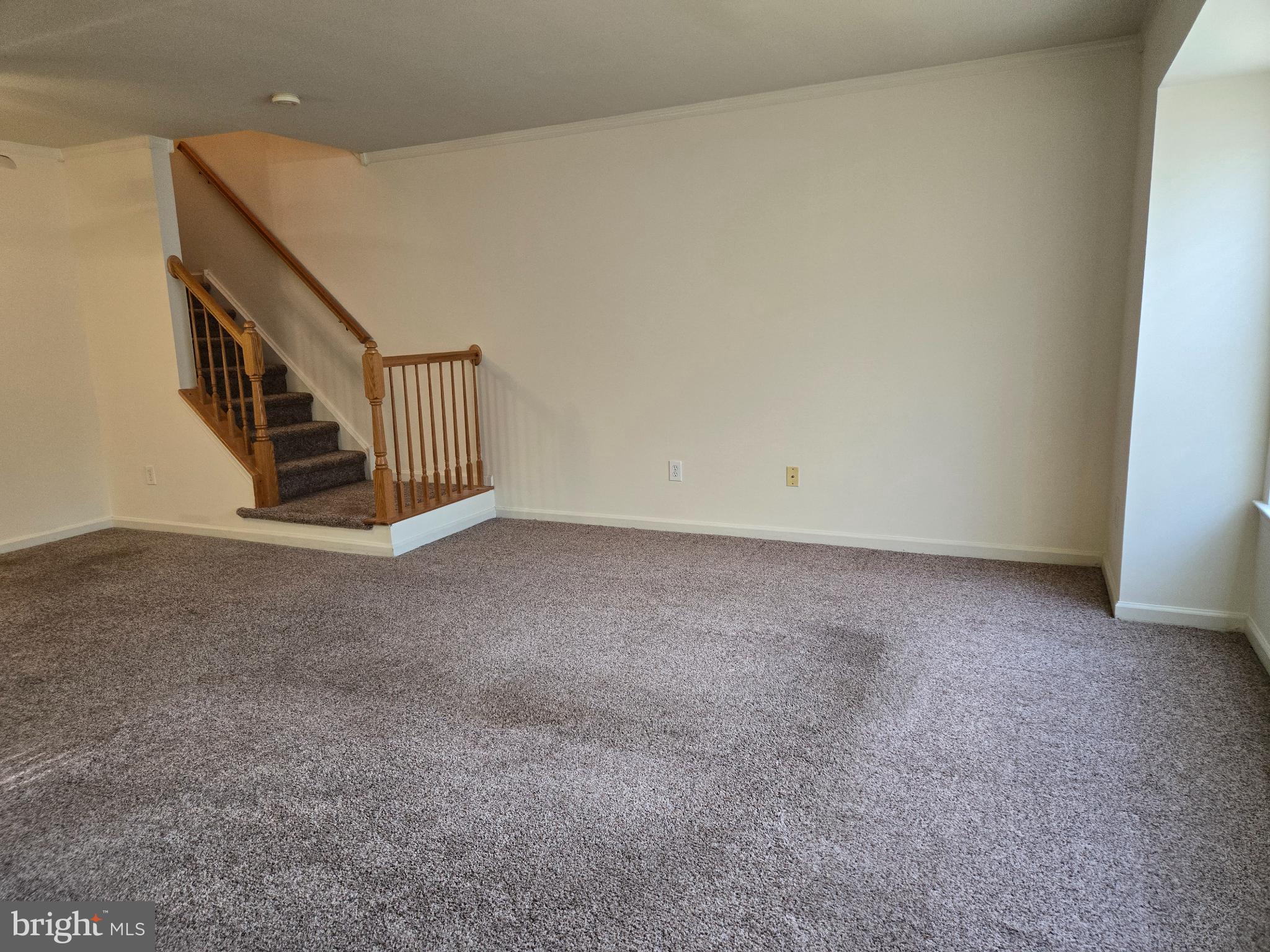 1302 Black Walnut Drive, Unit 1302 Phoenixville, PA 19460 - Photo 2 of 11 Spacious living area with inviting staircase.