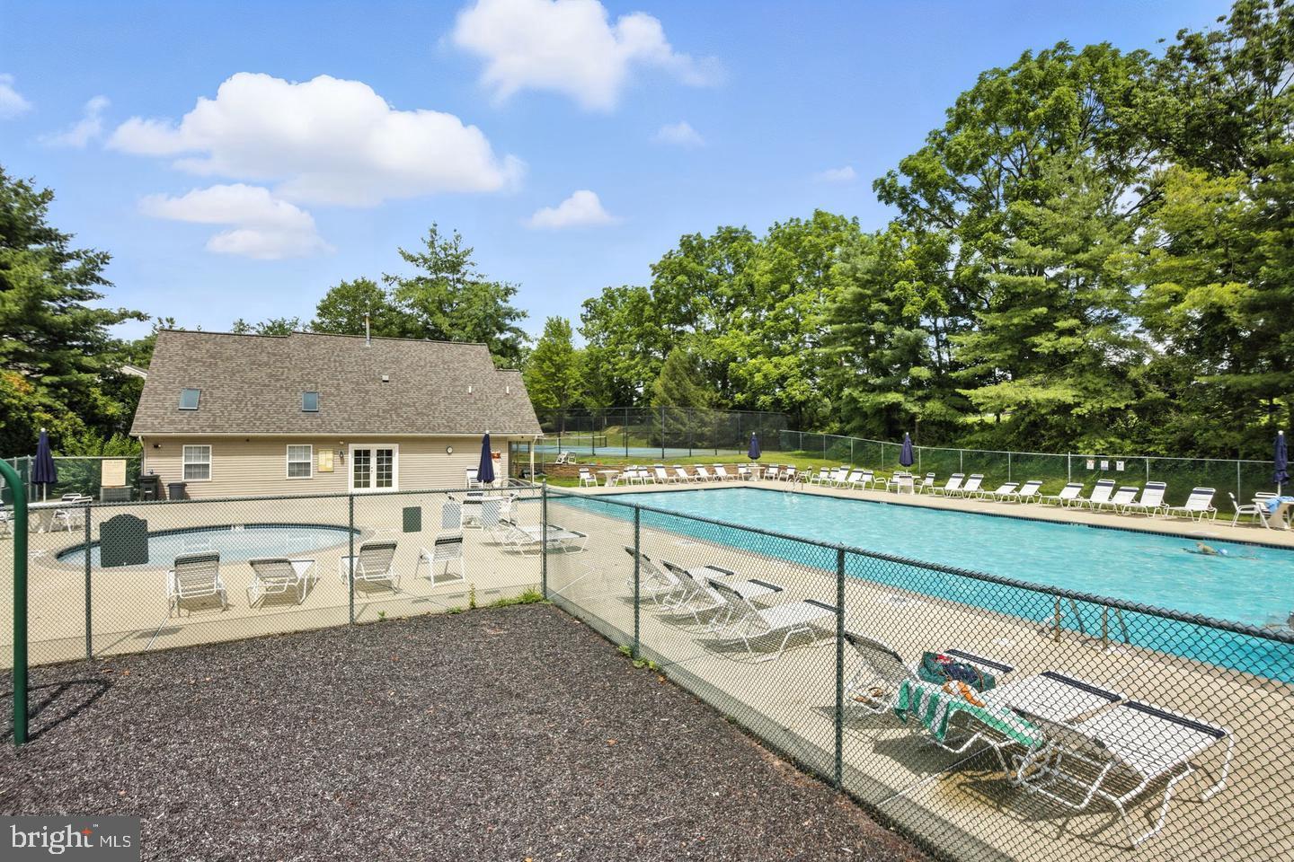 1302 Black Walnut Drive, Unit 1302 Phoenixville, PA 19460 - Photo 10 of 11 Serene poolside retreat surrounded by nature.