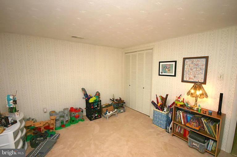497 St Barbara Lane Odenton, MD 21113 - Photo 16 of 25 a view of a room with furniture and toys