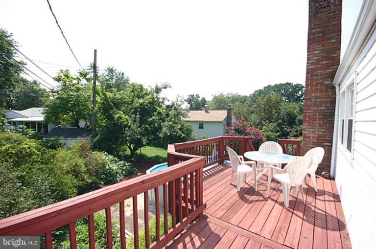 497 St Barbara Lane Odenton, MD 21113 - Photo 20 of 25 a view of a balcony with two chairs and a table