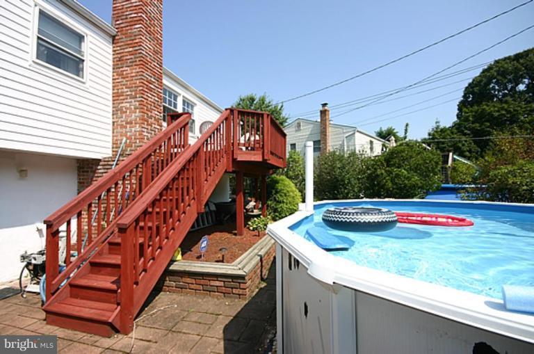 497 St Barbara Lane Odenton, MD 21113 - Photo 24 of 25 a view of swimming pool with deck and yard
