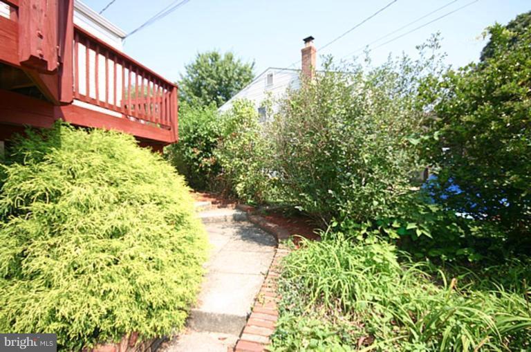 497 St Barbara Lane Odenton, MD 21113 - Photo 25 of 25 a view of a garden with pathway