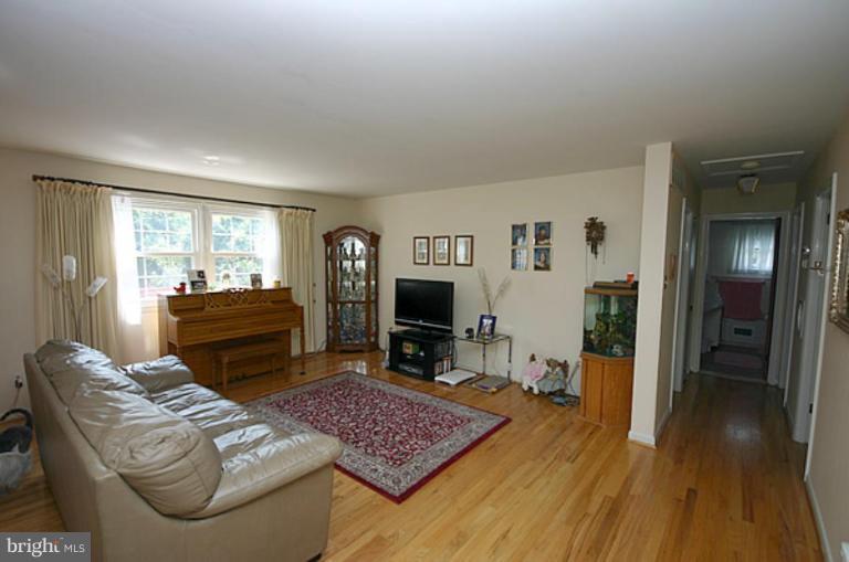 497 St Barbara Lane Odenton, MD 21113 - Photo 6 of 25 a living room with furniture and a flat screen tv