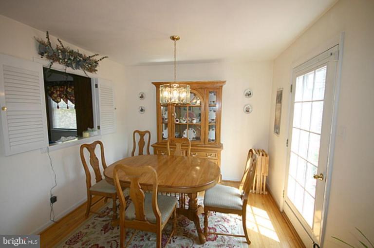 497 St Barbara Lane Odenton, MD 21113 - Photo 9 of 25 a view of a dining room with furniture window and outside view