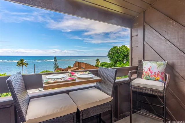 a outdoor living space with furniture and a potted plant