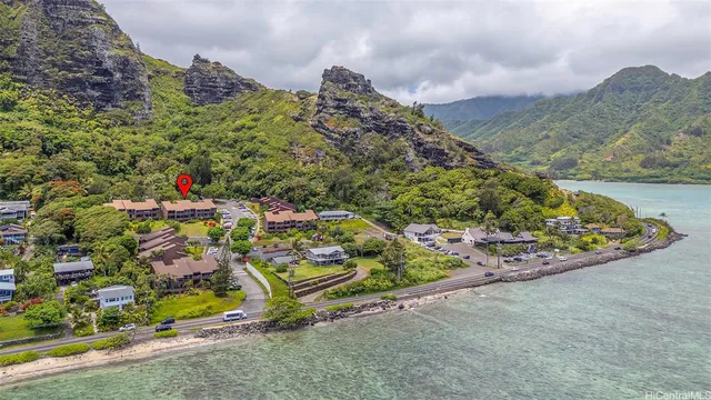 an aerial view of a houses with a road
