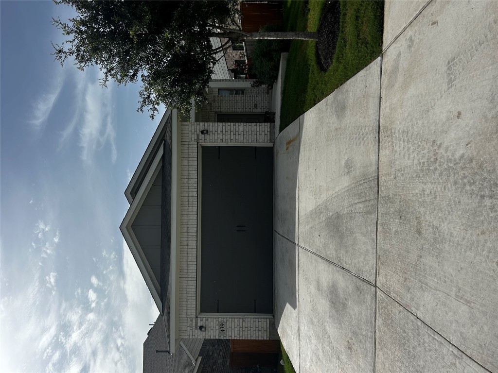 a front view of a house with garage