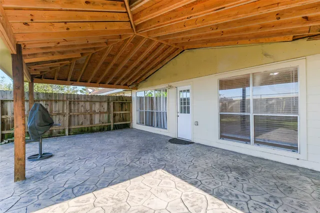 a view of a backyard of the house