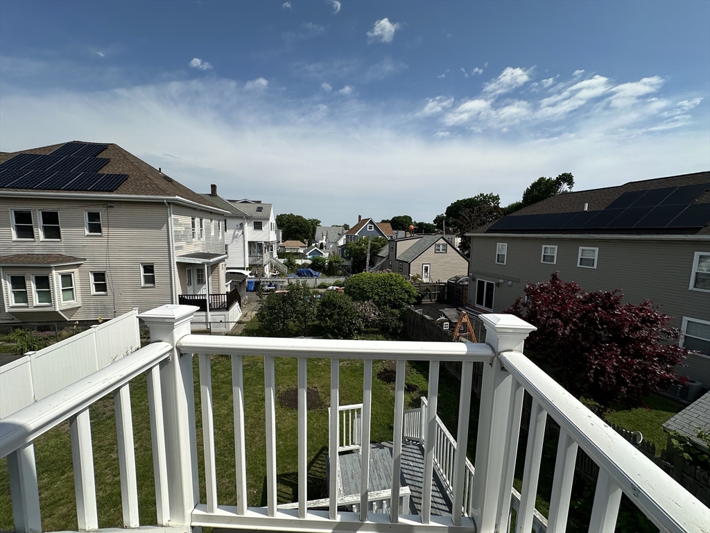 304 Main Street, Unit 2 Winthrop, MA 02152 - Photo 7 of 9 a view of a house with wooden deck and furniture