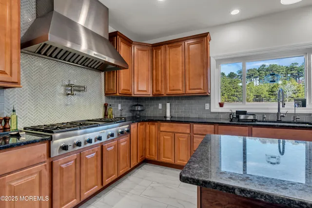 a view of an entryway wooden floor and a window