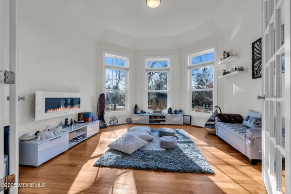 a living room with furniture fireplace and a flat screen tv