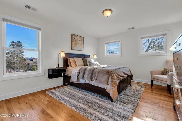 a kitchen with sink and view of living room
