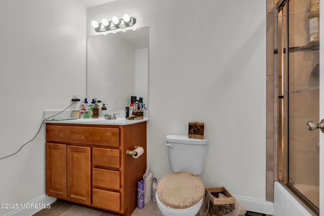 a large white kitchen with a large window